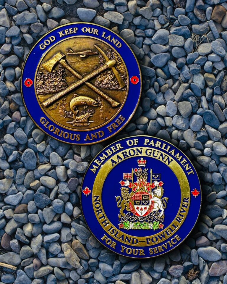 Both faces of the MP Distinguished Service Award commemorative coin